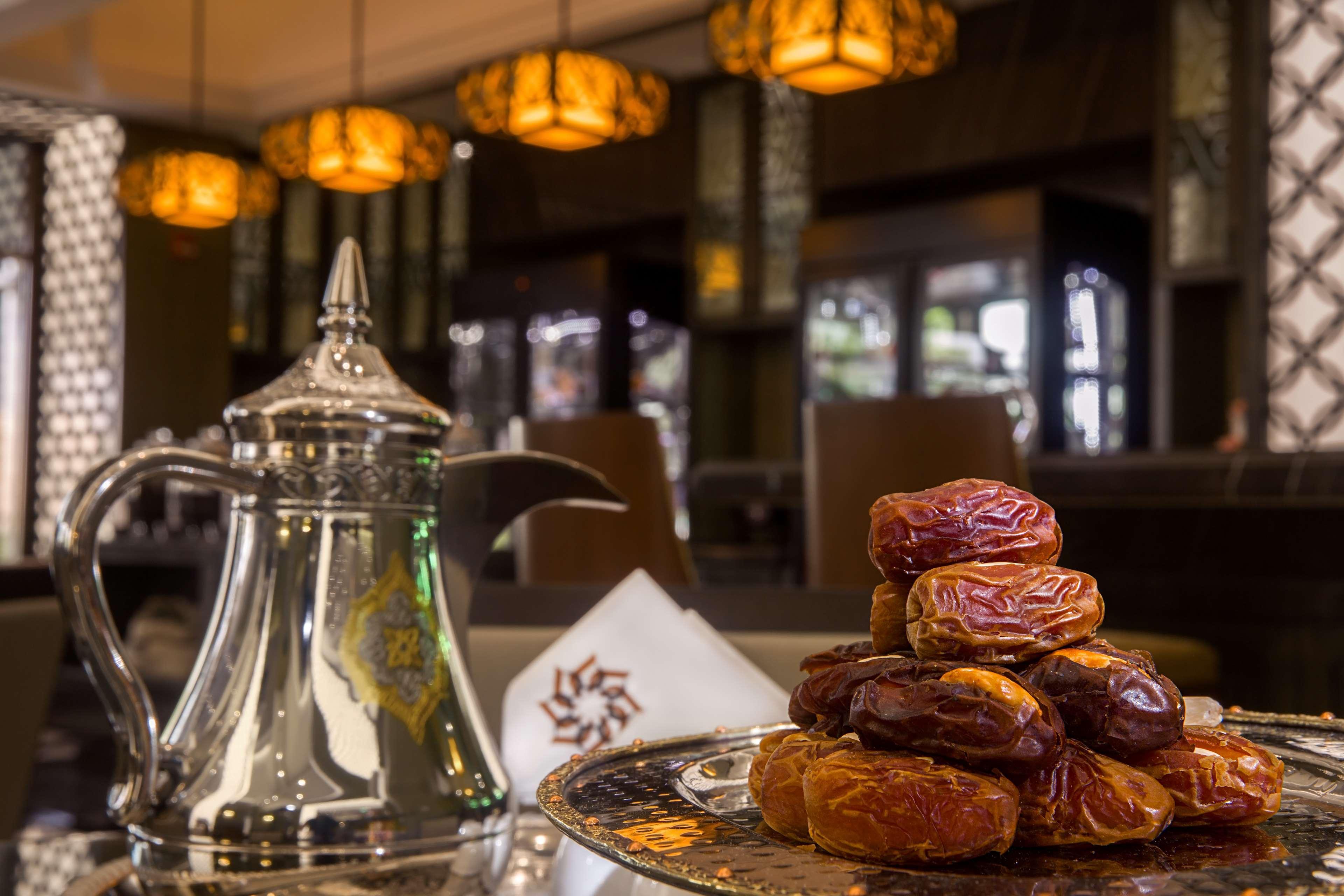 Ayla Grand Hotel Al Ain Exterior photo Arabic coffee pot and dates
